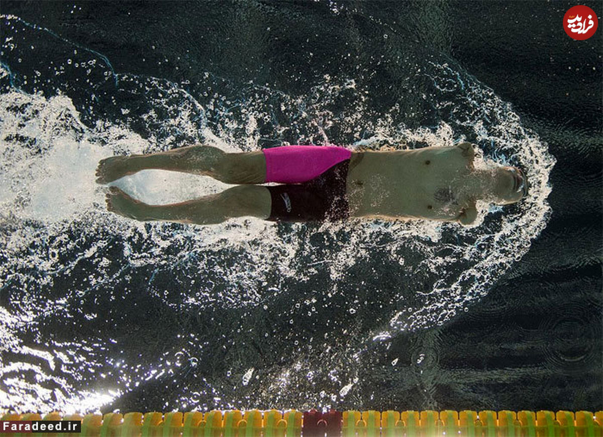 تصاویر/ قهرمان بدون دست شنا در پارالمپیک