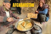 ببینید؛ غذای روستایی در افغانستان؛ پخت بولانی در غار توسط زوج سالخورده افغان
