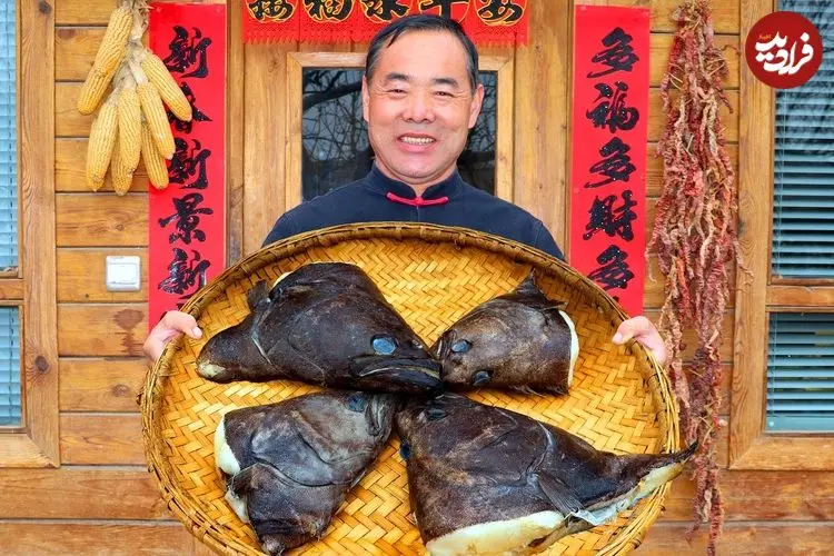 ببینید| غذای روستایی در چین؛ پخت یک غذای سنتی با کله ماهی در هوای برفی