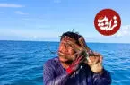ببینید| لحظات عجیب درگیری ماهیگیر با یک اختاپوس