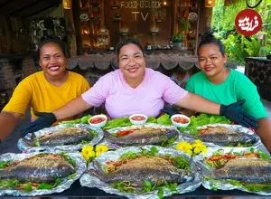 ببینید| غذای روستایی در سنگاپور؛ کباب ماهی در برگ موز روی آتش