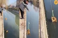 (ویدئو) ابتکار مرد جوان برای نجات گربه از داخل رودخانه