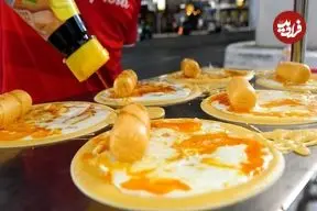 ببینید| غذای خیابانی در تایلند؛ تهیه محبوب ترین پنکیک تخم مرغ در بانکوک