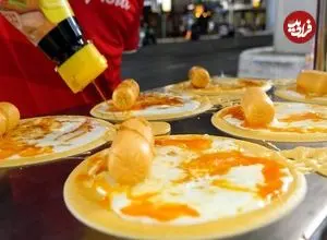 ببینید| غذای خیابانی در تایلند؛ تهیه محبوب ترین پنکیک تخم مرغ در بانکوک