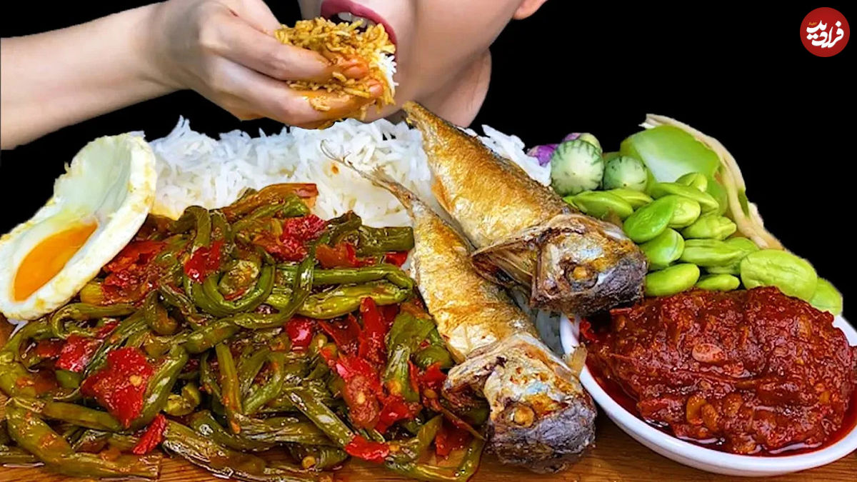 (ویدئو) غذا خوردن به سبک دختر مشهور تایلندی؛ خوردن یک کیلو چلو ماهی