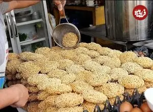 ببینید| غذای خیابانی در تایلند؛ نودل با میگو، سبزیجات و برنج سرخ شده در بانکوک