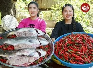 ببینید| غذای روستایی در کامبوج؛ پخت یک غذای سنتی با ماهی بزرگ و فلفل قرمز در تابه