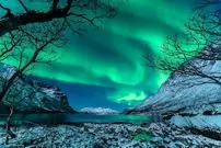 عکس روز ناسا؛ رقص سبز شفق‌ها در آسمان نروژ