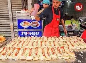ببینید| غذای خیابانی در پاکستان؛ مهارت آشپز خیابانی در تهیه برگر با تخم مرغ در کراچی