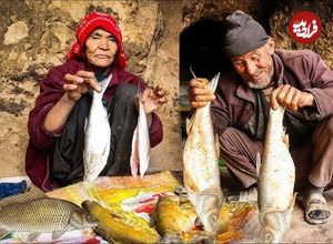 (ویدئو) پخت دیدنی 7 ماهی روی ساج توسط زوج مسن غارنشین افغانستانی