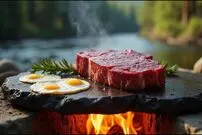 ببینید| غذای روستایی در آمریکا؛ پخت استیک و تخم مرغ روی سنگ در جنگل