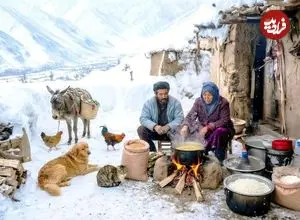 ببینید| غذای روستایی در افغانستان؛ پخت لپه پلو در غار در هوای برفی