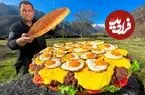 ببینید| غذای روستایی در آذربایجان؛ پخت چیزبرگر غول پیکر با تخم مرغ در روستا