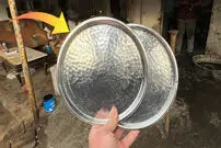 (ویدئو) فرآیند قلع اندود کردن ظروف مسی در کارگاهی در ترکیه 