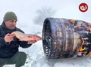 ببینید| غذای روستایی در آذربایجان؛ کباب کردن ماهی کپور در بشکه و در برف 