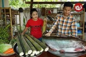 ببینید| غذای روستایی در چین؛ پخت یک غذای سنتی با ماهی رودخانه ای، بامبو و آناناس