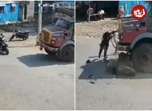 ببینید| نجات معجزه‌آسای دختر موتورسوار پس از تصادف با کامیون