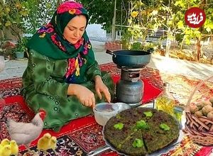 (ویدئو) پختن کوکوسبزی با گردو و زرشک به روش بانوی روستایی زاگرس نشین