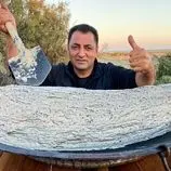 ببینید| غذای روستایی در آذربایجان؛ کباب کردن ماهی کپور با گِل و در آتش