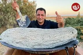 ببینید| غذای روستایی در آذربایجان؛ کباب کردن ماهی کپور با گِل و در آتش