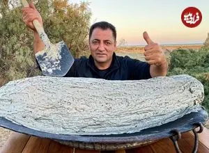 ببینید| غذای روستایی در آذربایجان؛ کباب کردن ماهی کپور با گِل و در آتش