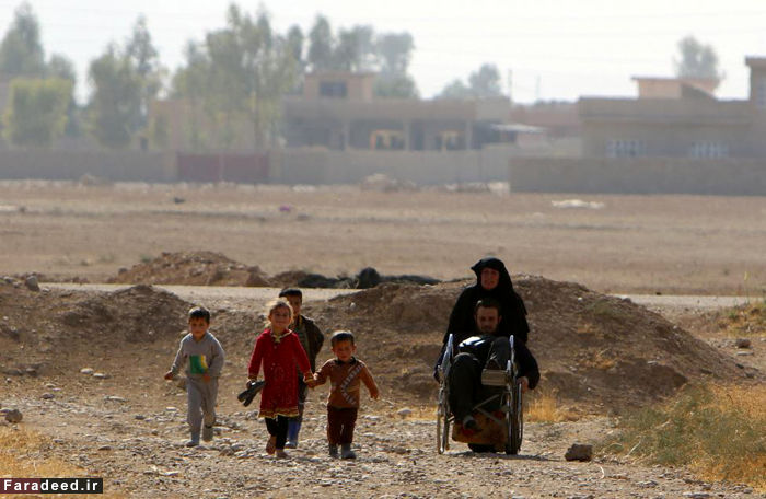 تصاویر/ فرار از دست داعش با ویلچر