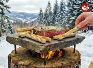 ببینید| غذای روستایی در لهستان؛ پخت استیک و تخم مرغ روی سنگ داغ در کوه های برفی