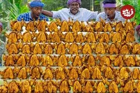 ببینید| غذای روستایی در هند؛ کباب ده ها مرغ کامل به روشی متفاوت در طبیعت