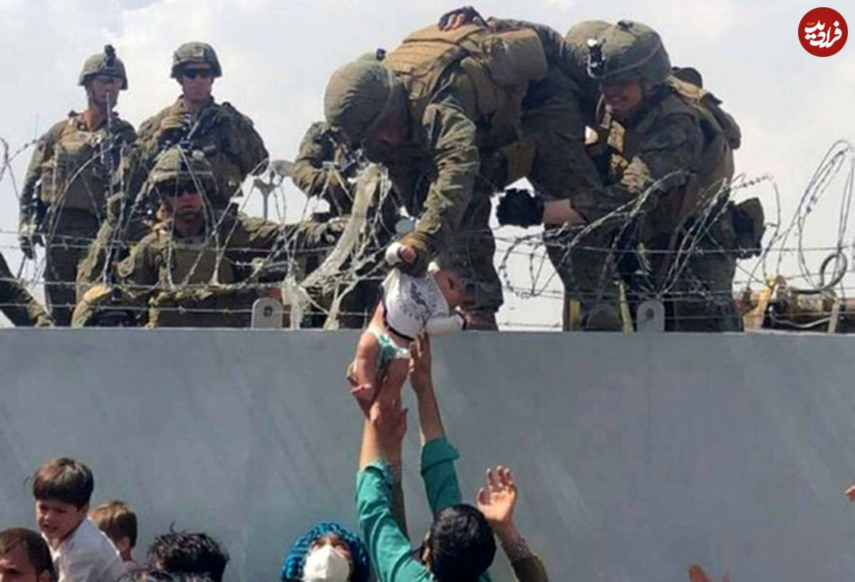 نوزاد افغان در آغوش سرباز آمریکایی؛ داستان عکسی که دست به دست شد
