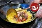 ببینید| غذای خیابانی در آمریکا؛ پخت یک غذای خاص با برنج، میگو، مرغ و بادام هندی در نیویورک