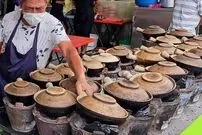 (ویدئو) غذاهای مشهور خیابانی؛ سریعترین چیکن رایس دنیا در خیابان های مالزی