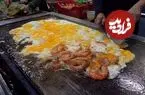 ببینید| غذای خیابانی در مالزی؛ میگوی سرخ شده با برنج و تخم مرغ در کوالالامپور