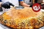 ببینید| غذای خیابانی در آمریکا؛ پخت پیتزای غول پیکر با گوشت و سوسیس در نیویورک