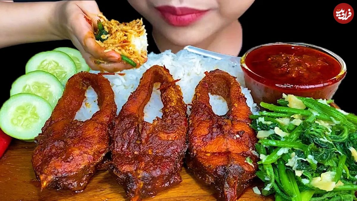 (ویدئو) خوردن یک کیلوگرم چلو ماهی به سبک جالب و دیدنی دختر مشهور و جوان تایلندی