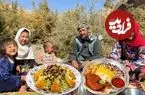 ببینید| غذای روستایی در افغانستان؛ پخت زرشک پلو با مرغ توسط زوج افغان در کنار رودخانه