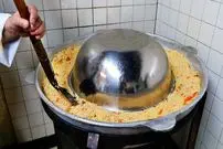 ببینید| غذای خیابانی در آمریکا؛ پخت ازبکی پلو با گوشت بره در شیکاگو