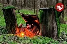 ببینید| ساخت یک پناهگاه زیر زمینی مخفی بین دو تنه درخت در جنگل های آلمان