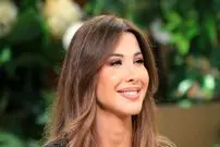 عکس| سفر در زمان؛ «نانسی عجرم» هنگام ورود به هتل جمیرا مسیله در کویت؛ سال 1394