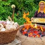 ببینید| غذای روستایی در ایران؛ پخت حرفه ای نان سیر در طبیعت روستا