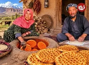 ببینید| غذای روستایی در افغانستان؛ پخت نان سنتی فطیر توسط زوج مسن افغان