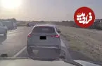 ببینید| نجات معجزه‌آسای راننده یک خودروی آتش گرفته