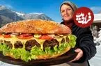 ببینید| غذای روستایی در آذربایجان؛ پخت ساندویچ همبرگر غول پیکر در کوهستانی برفی