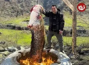 ببینید| غذای روستایی در آذربایجان؛ صید گربه ماهی بزرگ و کباب کردن آن در تنور