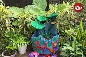 ببینید| چگونه با چرخ قدیمی دوچرخه و سیمان یک حوض زیبا بسازیم؟