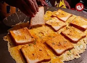 ببینید| غذای خیابانی در هند؛ پخت املت با تخم مرغ و نان تست در دهلی نو
