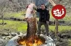ببینید| غذای روستایی در آذربایجان؛ صید یک گربه ماهی بزرگ و کباب کردن آن در تنور